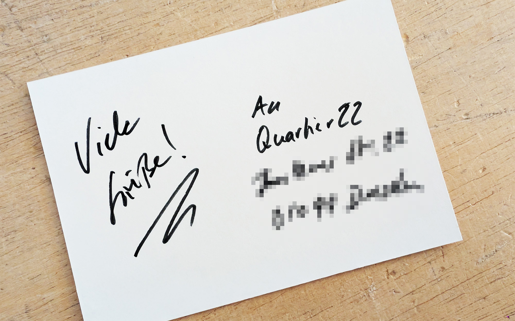 Quartier22-Datenschutz dekoratives Bild – Postkarte mit verpixelter Adresse des Coworking-Space